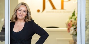 Jennifer Khoury smiling confidently, representing Jennifer Khoury Properties and her charity Shoulders of Support (SOS) – as featured on Industry Leaders TV.